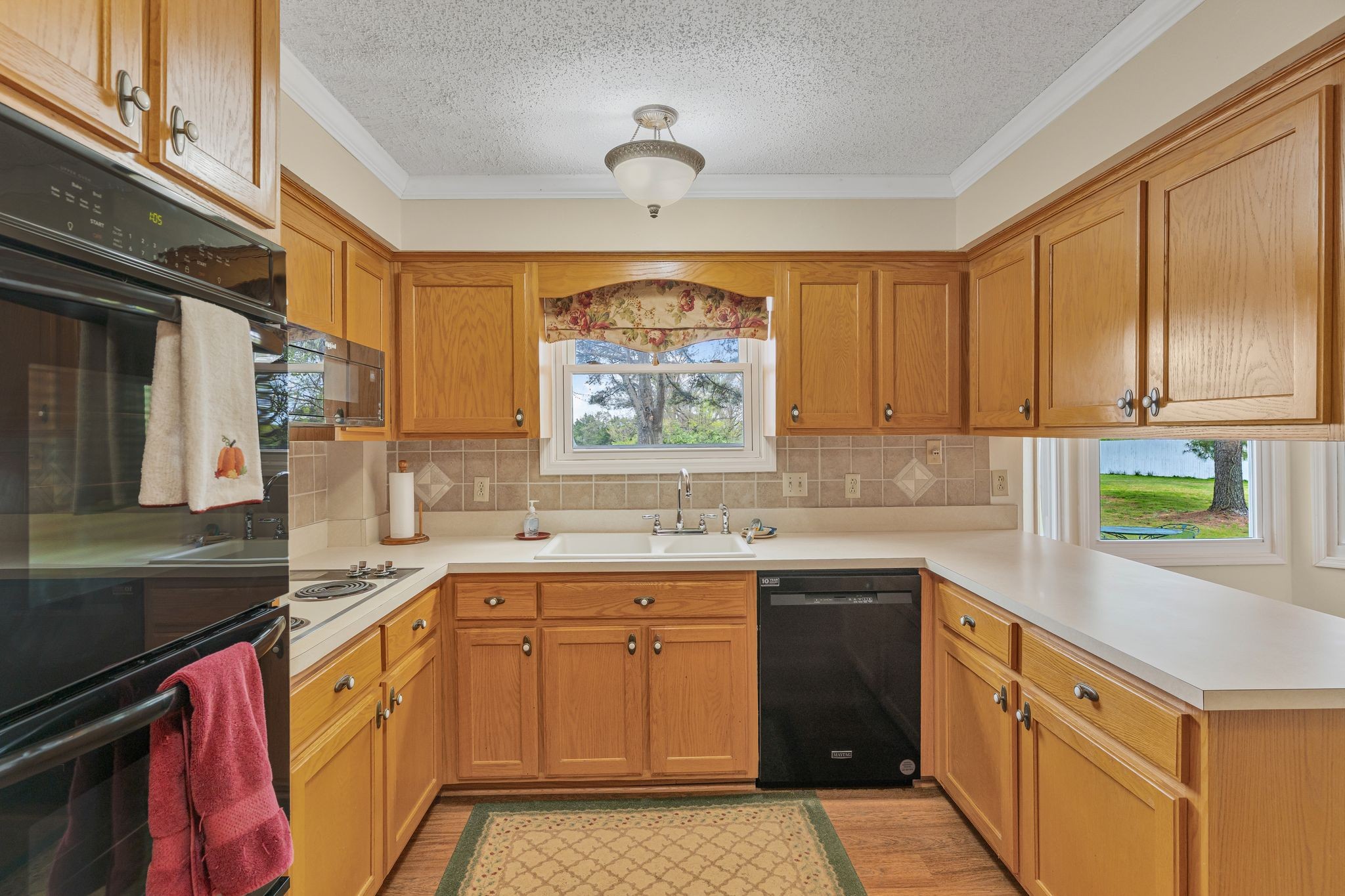 460 West Campbell Road Goodlettsville, TN 37072 - Photo 26 of 55 a kitchen with a sink stove and cabinets