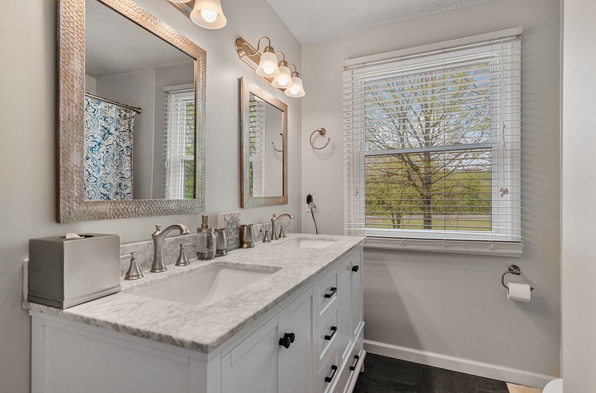 460 West Campbell Road Goodlettsville, TN 37072 - Photo 6 of 55 a bathroom with a granite countertop sink a large mirror a and a window