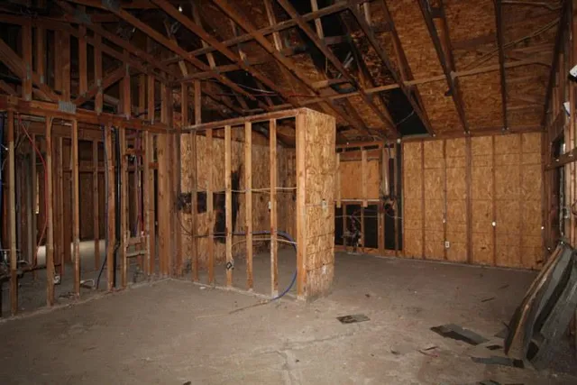 a view of an empty room with wooden walls
