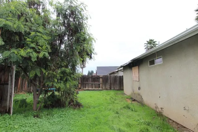 a backyard of a house with lots of green space