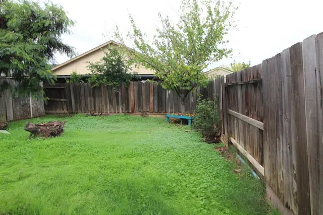 a backyard of a house with lots of green space