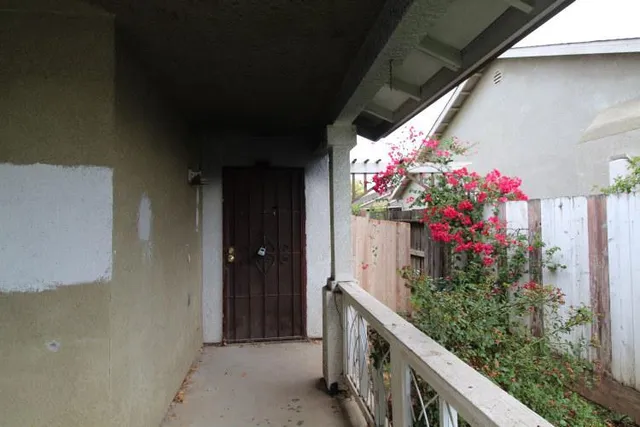 a view of a house with a flower garden
