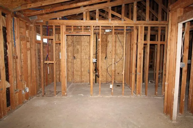 a view of an empty room with wooden walls