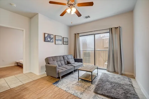 a living room with furniture and a window