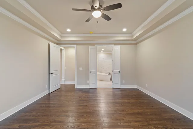 a bathroom with a sink a mirror a bathtub and shower