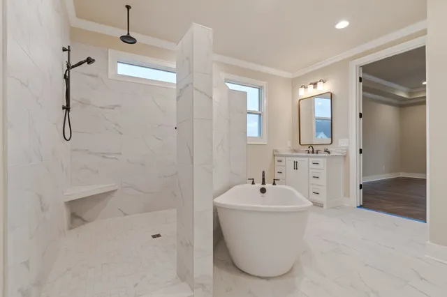 a bathroom with a bathtub and a sink