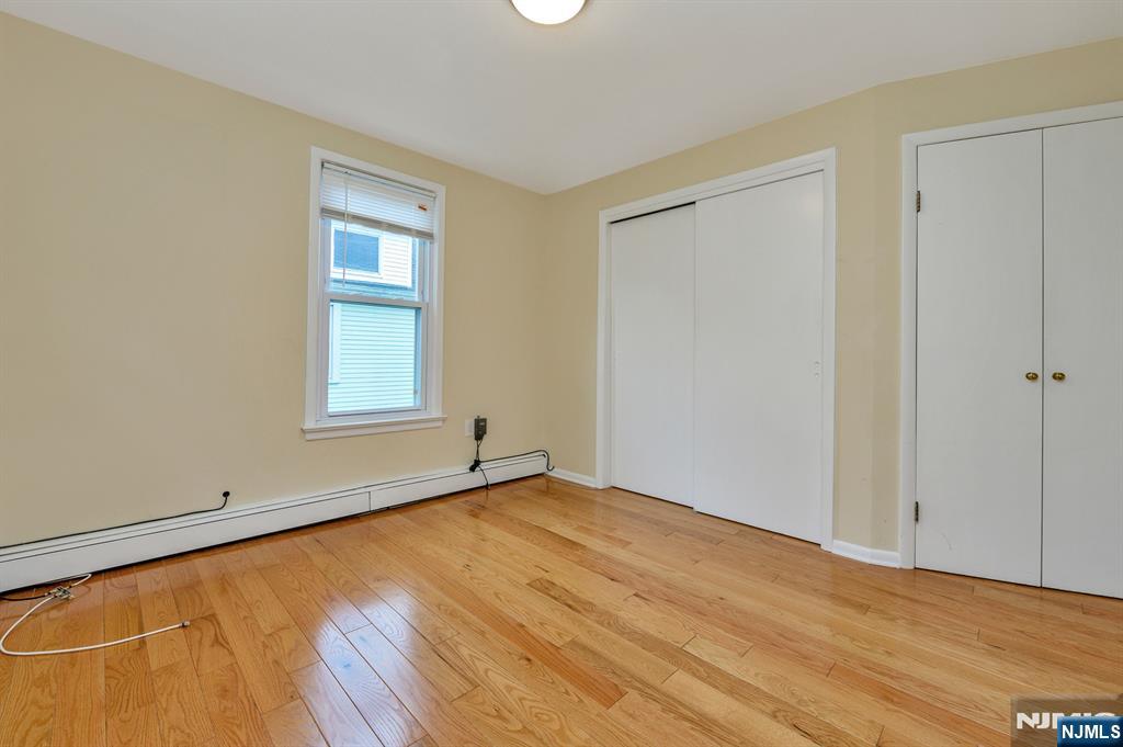 32 Washburn Place, Unit 1 Caldwell, NJ 07006 - Photo 12 of 16 an empty room with windows