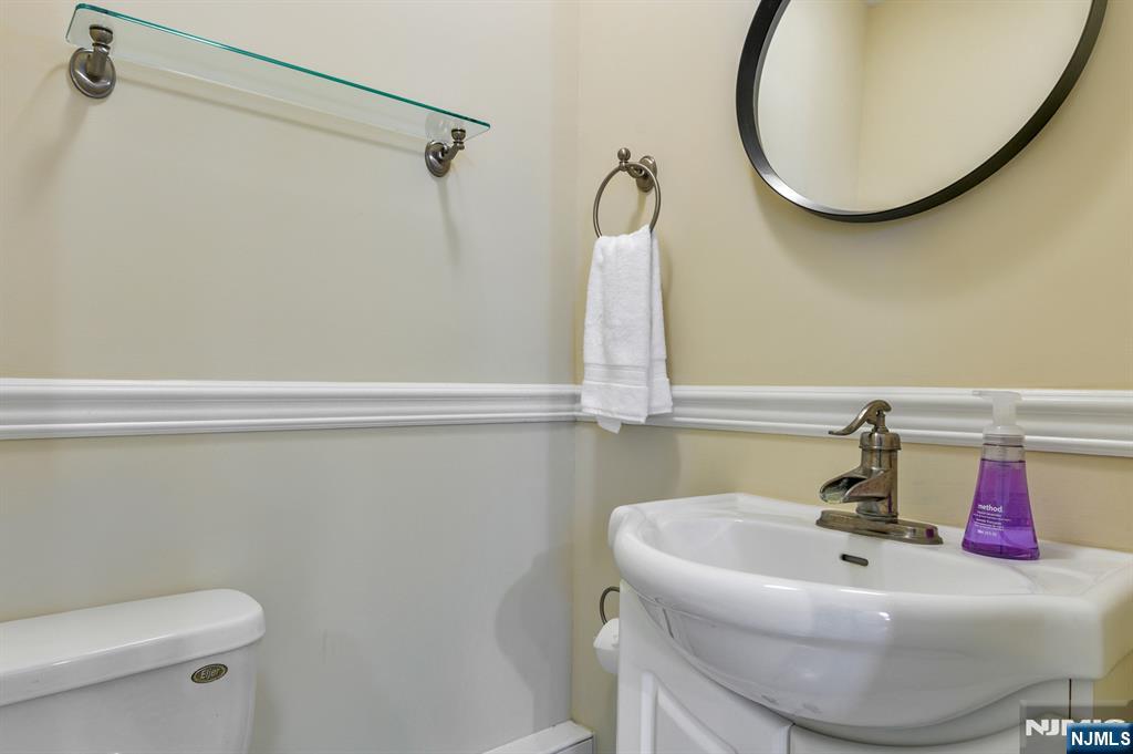 32 Washburn Place, Unit 1 Caldwell, NJ 07006 - Photo 9 of 16 a bathroom with a sink and a mirror