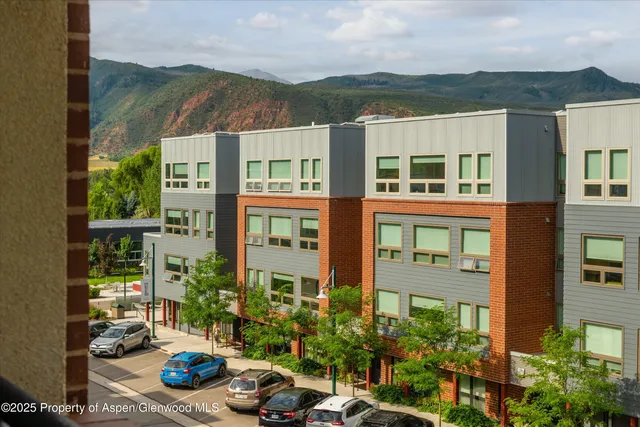 a view of a patio with table and chairs and potted plants