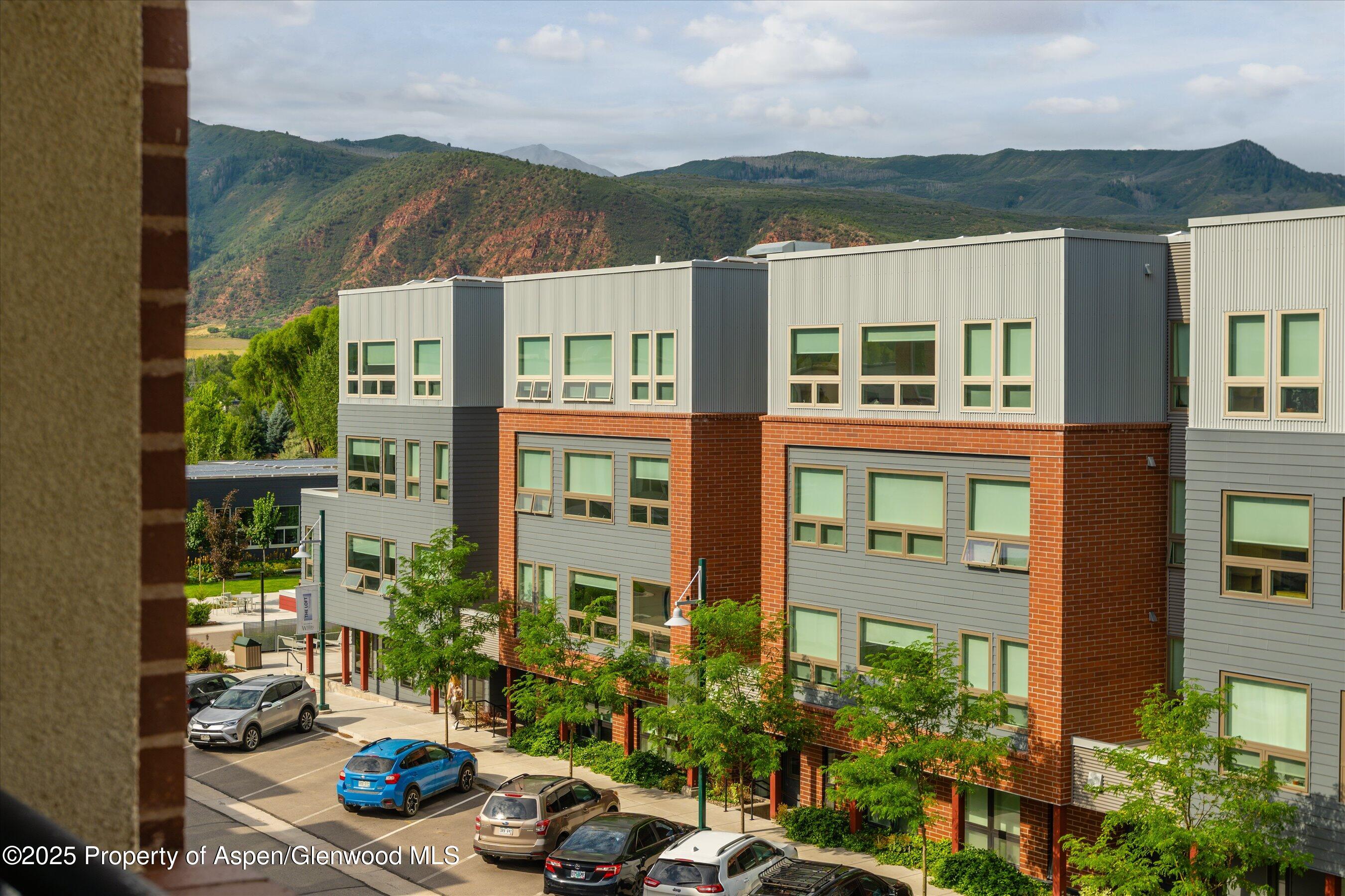 361 Robinson Street, Unit 308 Basalt, CO 81621 - Photo 20 of 23 front view of a house with a yard