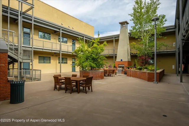 a view of a dinning table and chairs in the patio