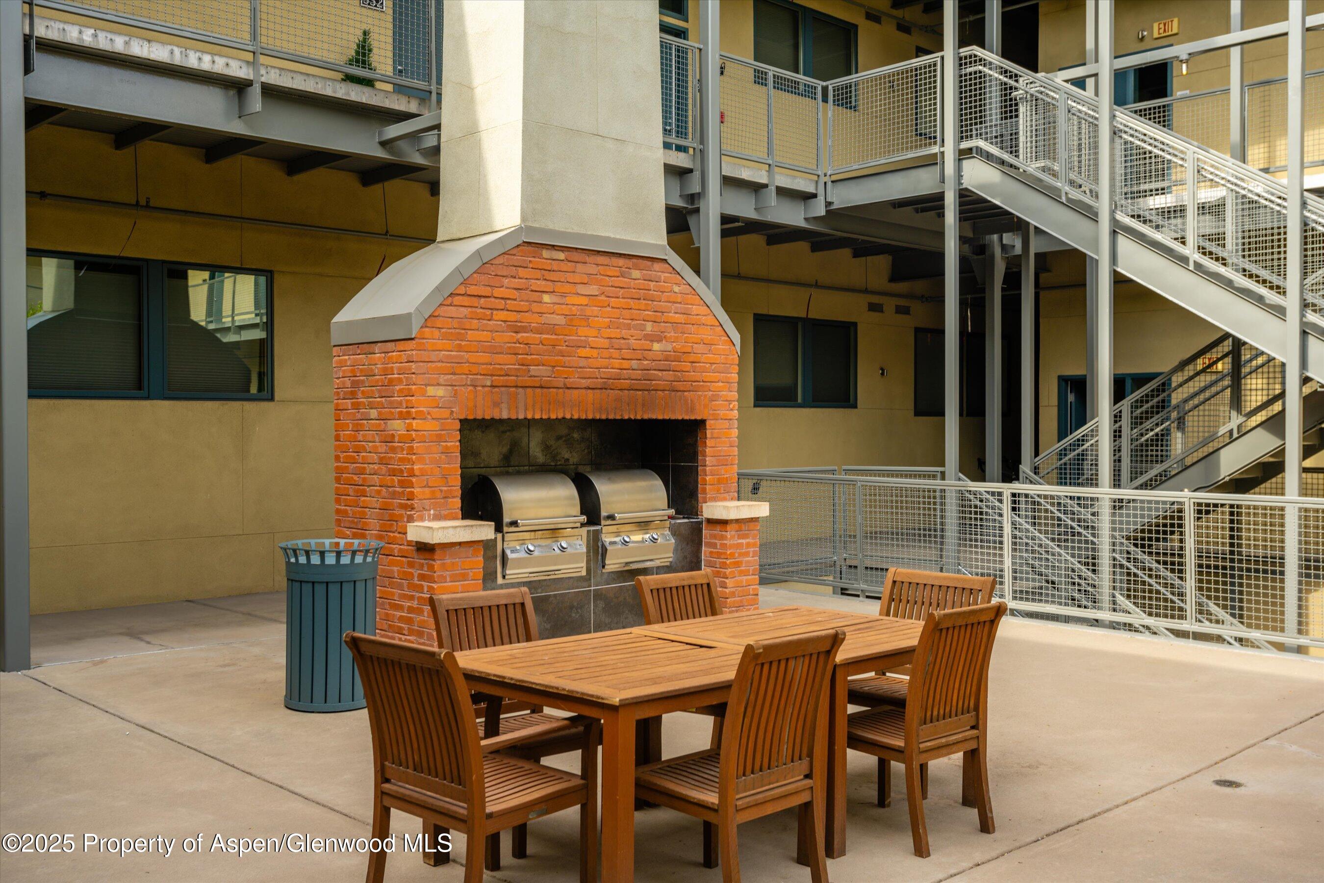 361 Robinson Street, Unit 308 Basalt, CO 81621 - Photo 22 of 23 a view of a dinning table and chairs in the patio