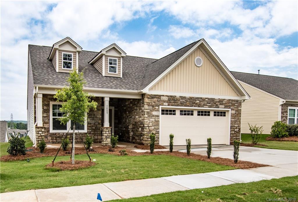 1889 Larkspur Way Tega Cay, SC 29708 - Photo 2 of 29 a front view of a house with a yard
