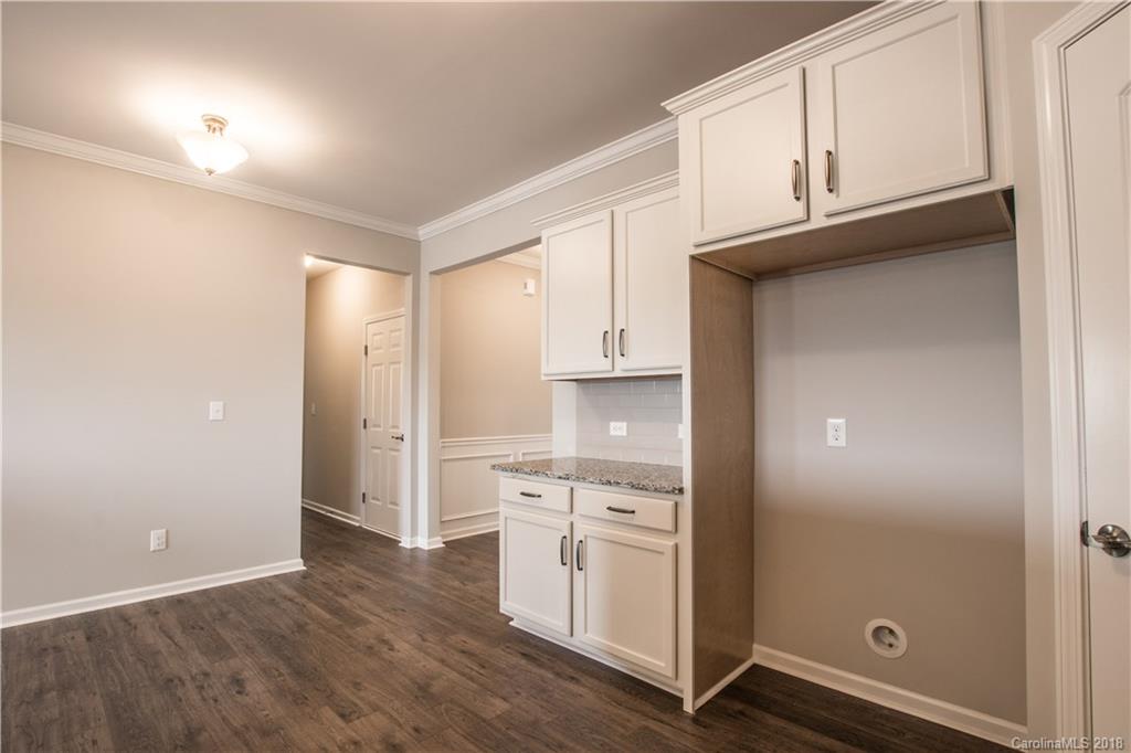 1889 Larkspur Way Tega Cay, SC 29708 - Photo 14 of 29 a view of cabinets a sink and dishwasher in a kitchen