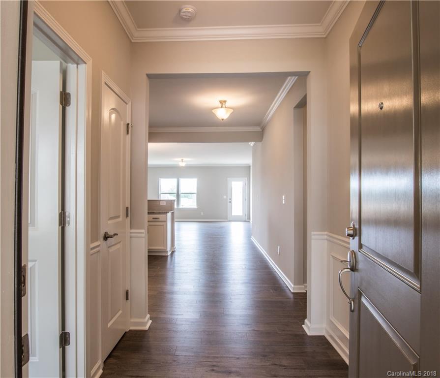 1889 Larkspur Way Tega Cay, SC 29708 - Photo 4 of 29 a view of a hallway with wooden floor
