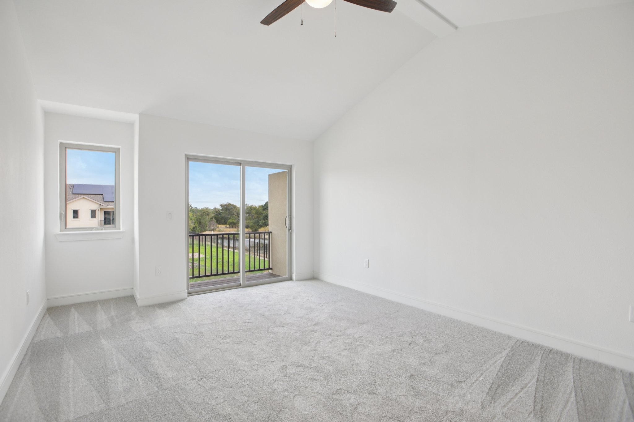 202 Tesla Circle Austin, TX 78681 - Photo 29 of 35 Empty room with light colored carpet and a ceiling fan