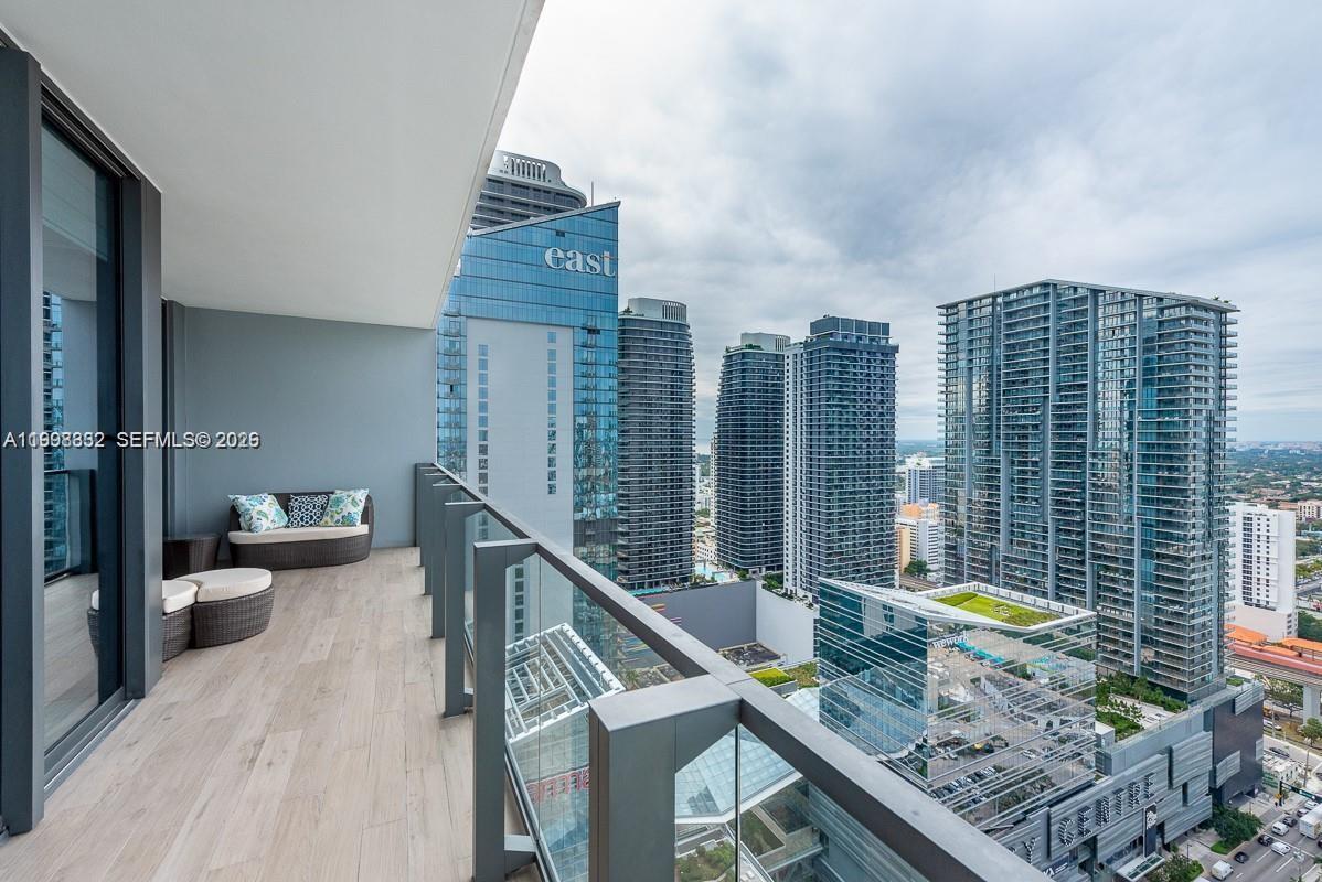 68 Southeast 6th Street, Unit 3006 Miami, FL 33131 - Photo 2 of 10 a view of deck with furniture