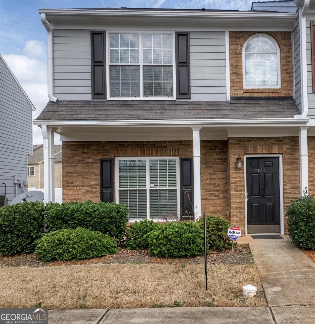 2851 Walden Lake Bend Decatur, GA 30035 - Photo 1 of 17 a front view of a house with a garden