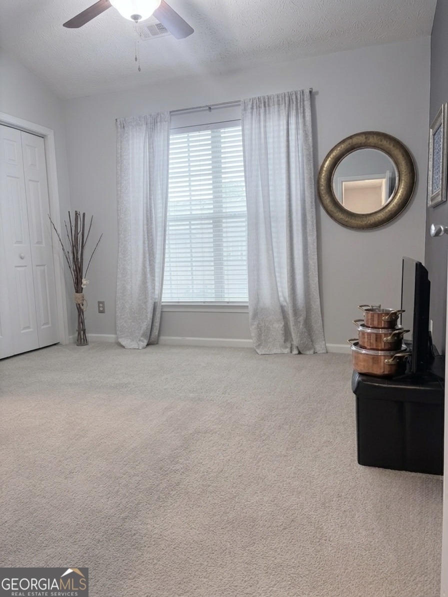 2851 Walden Lake Bend Decatur, GA 30035 - Photo 12 of 17 a view of a livingroom with a furniture and a window