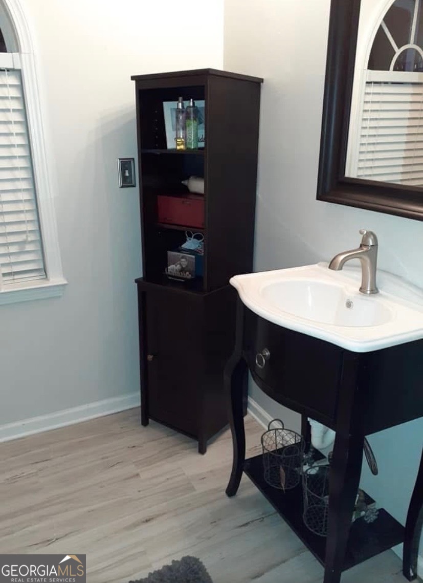 2851 Walden Lake Bend Decatur, GA 30035 - Photo 16 of 17 a room with a table chairs and a wooden floor