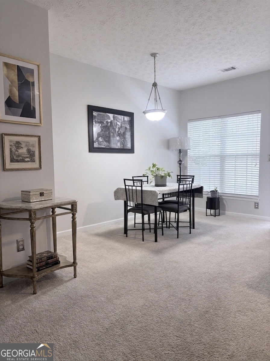 2851 Walden Lake Bend Decatur, GA 30035 - Photo 6 of 17 a view of a workspace with furniture and a window