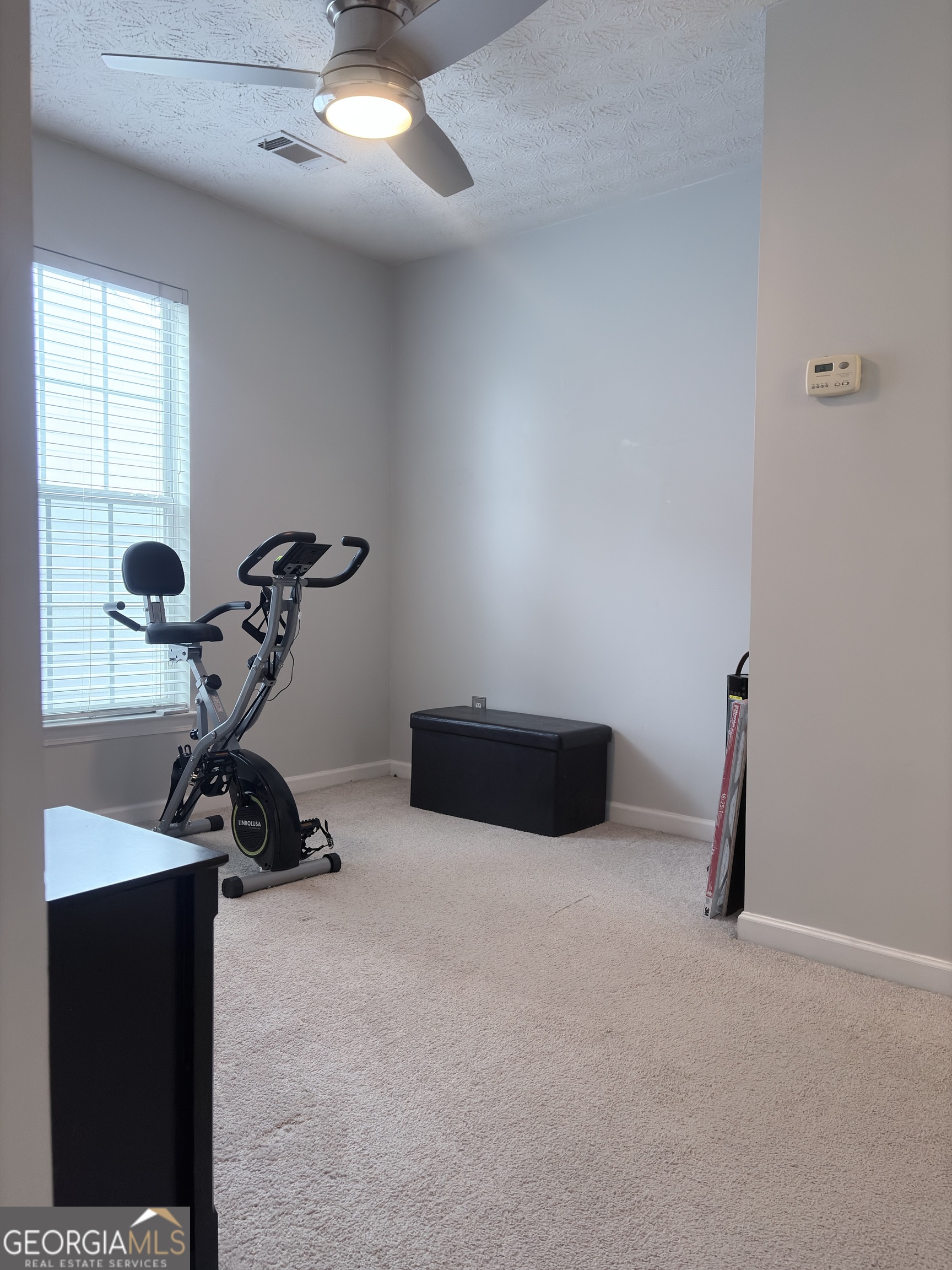 2851 Walden Lake Bend Decatur, GA 30035 - Photo 8 of 17 a room with gym equipment and a window