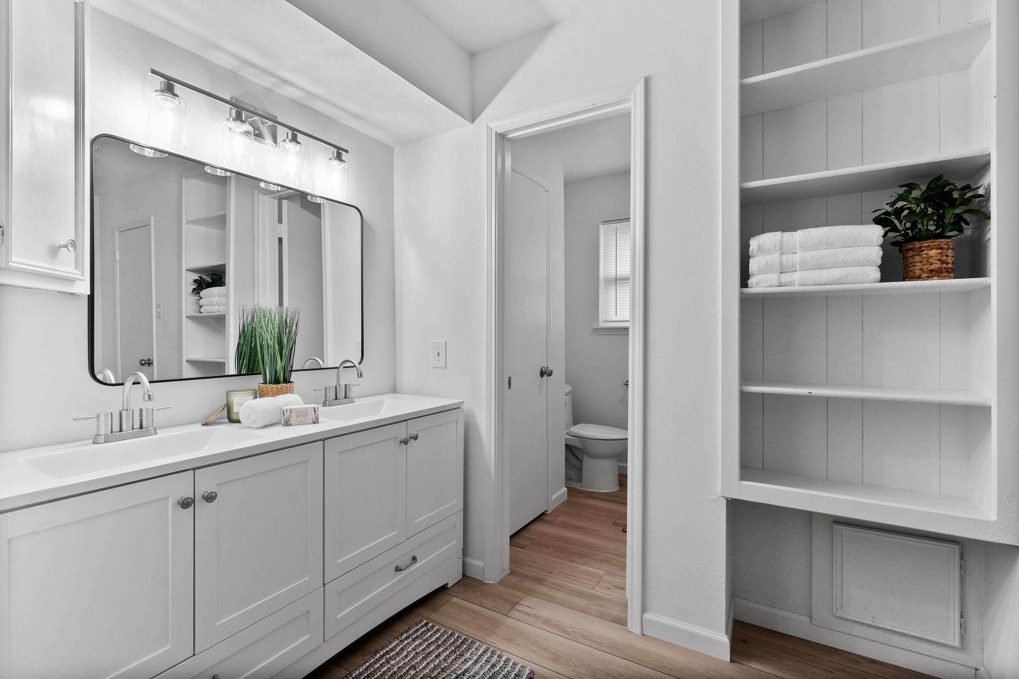 21710 Glenbranch Drive Spring, TX 77388 - Photo 16 of 32 a bathroom with a double vanity sink a mirror and a