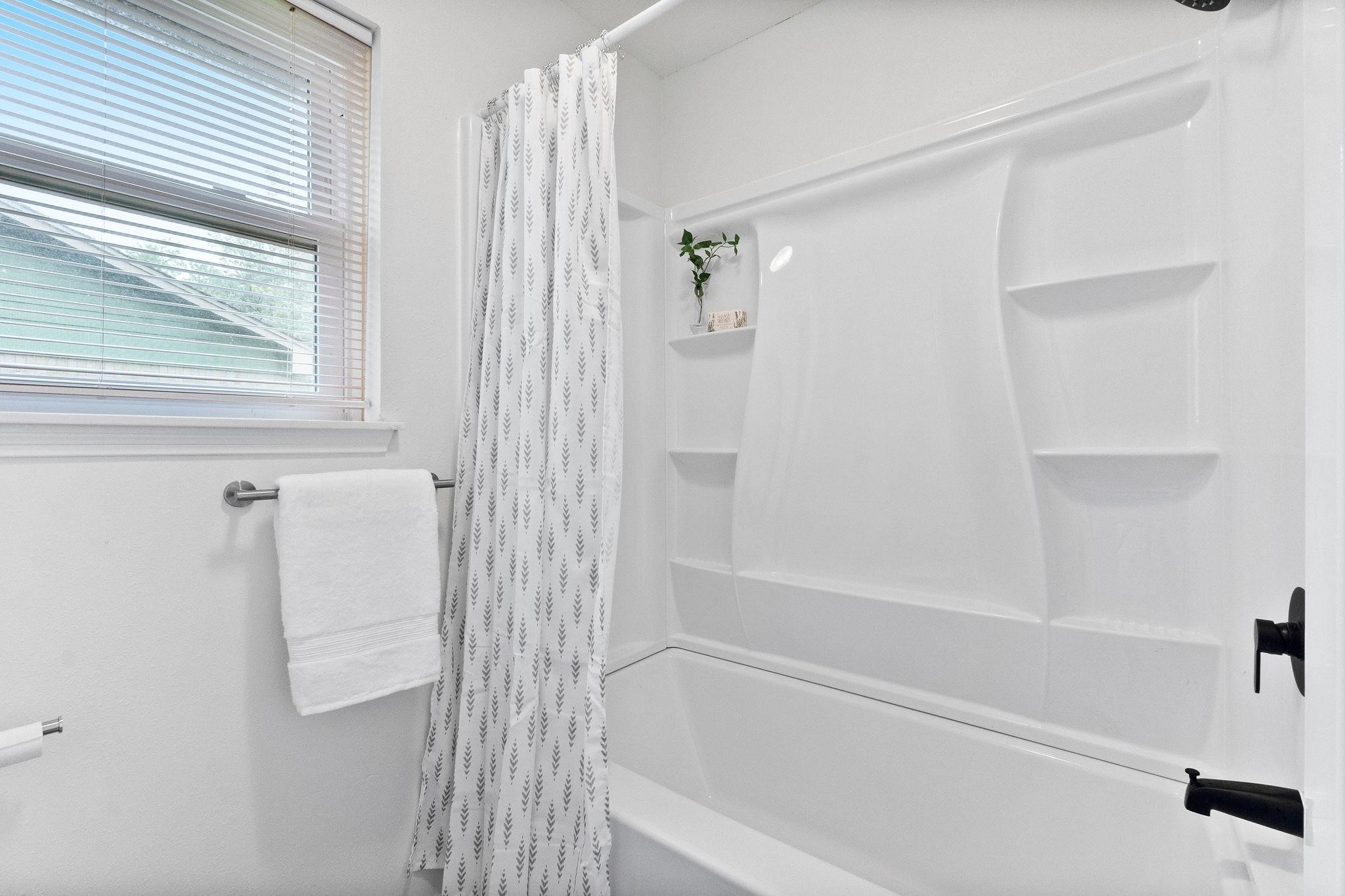 21710 Glenbranch Drive Spring, TX 77388 - Photo 17 of 32 a bathroom with a bathtub