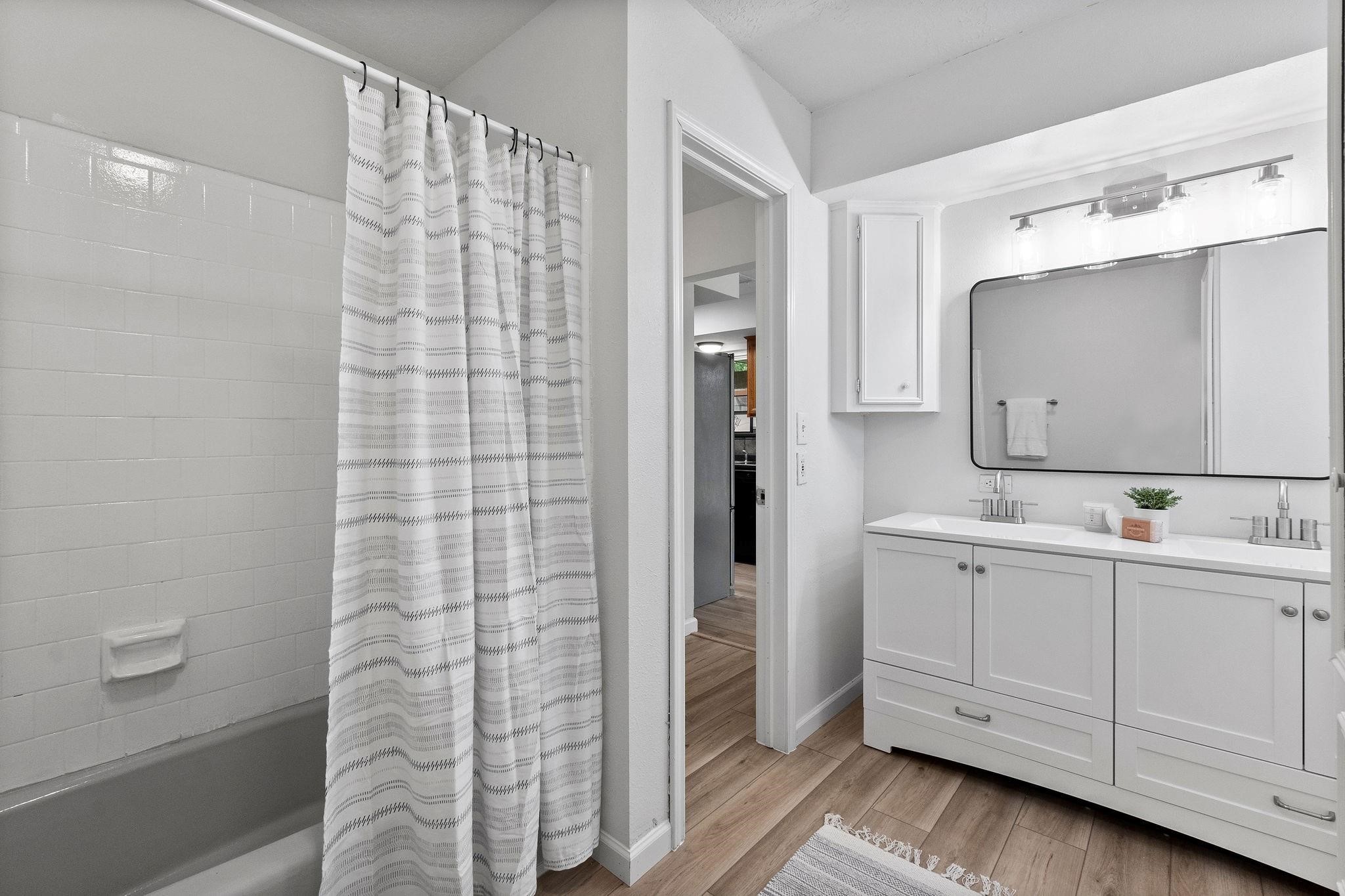 21710 Glenbranch Drive Spring, TX 77388 - Photo 20 of 32 a bathroom with a double vanity sink mirror and shower