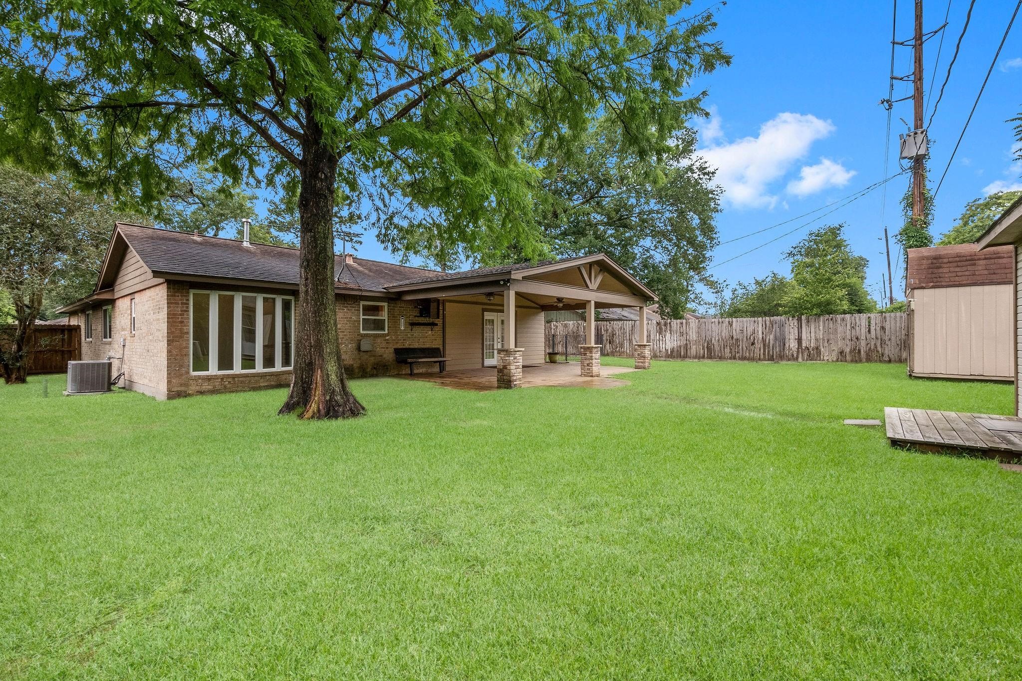 21710 Glenbranch Drive Spring, TX 77388 - Photo 28 of 32 a view of a house with a yard deck and a small yard