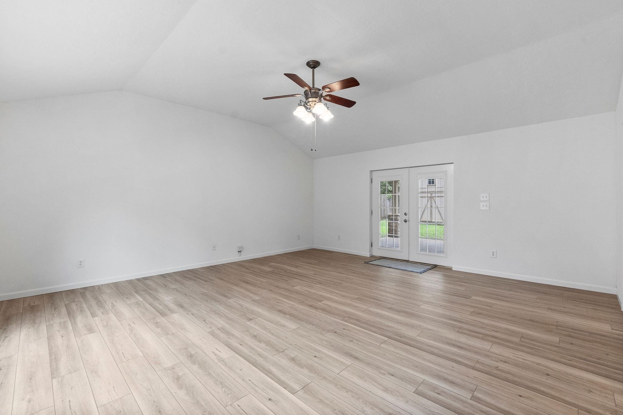 21710 Glenbranch Drive Spring, TX 77388 - Photo 6 of 32 wooden floor in an empty room with a window