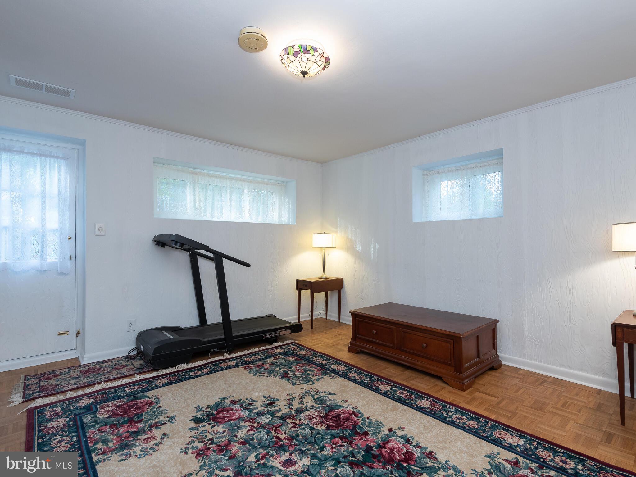 112 Whitemarsh Road Ardmore, PA 19003 - Photo 22 of 27 Lower Level Family Room Leads to Patio