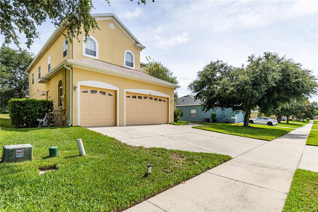 2718 Knightsbridge Road Clermont, FL 34711 - Photo 55 of 72 a view of a house with a yard and tree s
