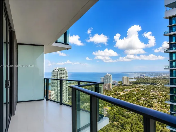 a view of a balcony with an outdoor seating