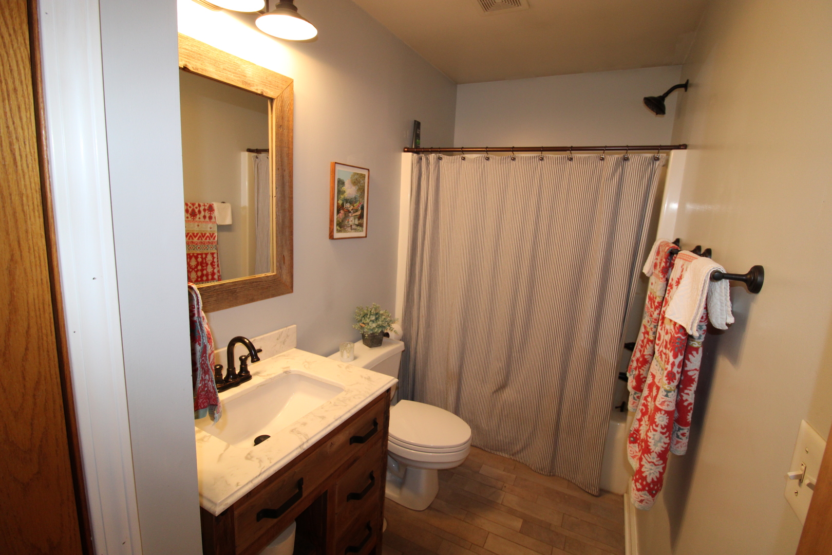 1709 Deerpass Road Marengo, IL 60152 - Photo 16 of 34 a bathroom with a granite countertop sink and a mirror