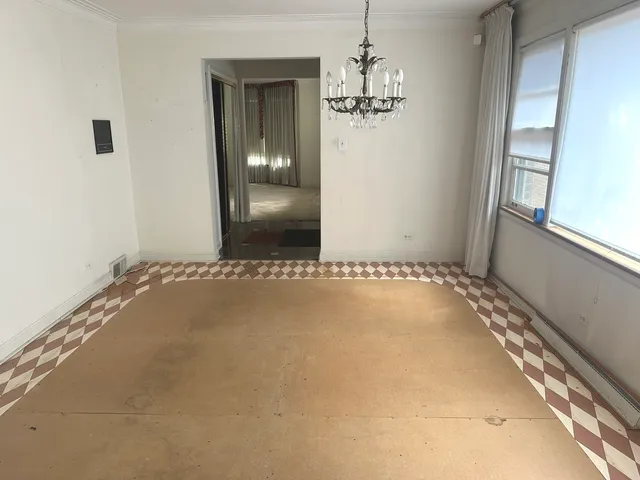 a bathroom with a granite countertop sink a mirror and a shower