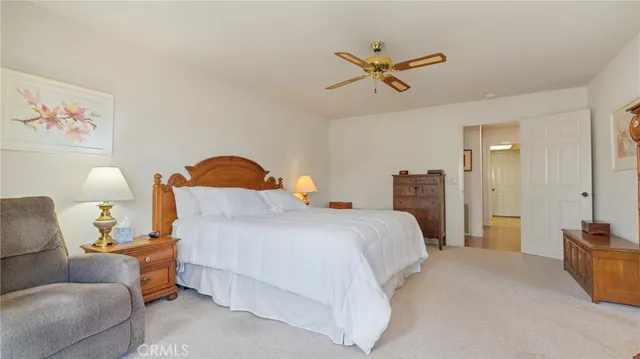 a living room with furniture and painting on the wall