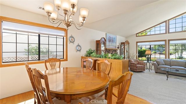 a kitchen with stainless steel appliances a sink stove and cabinets