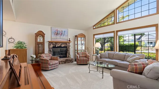 a living room with furniture fireplace and flat screen tv