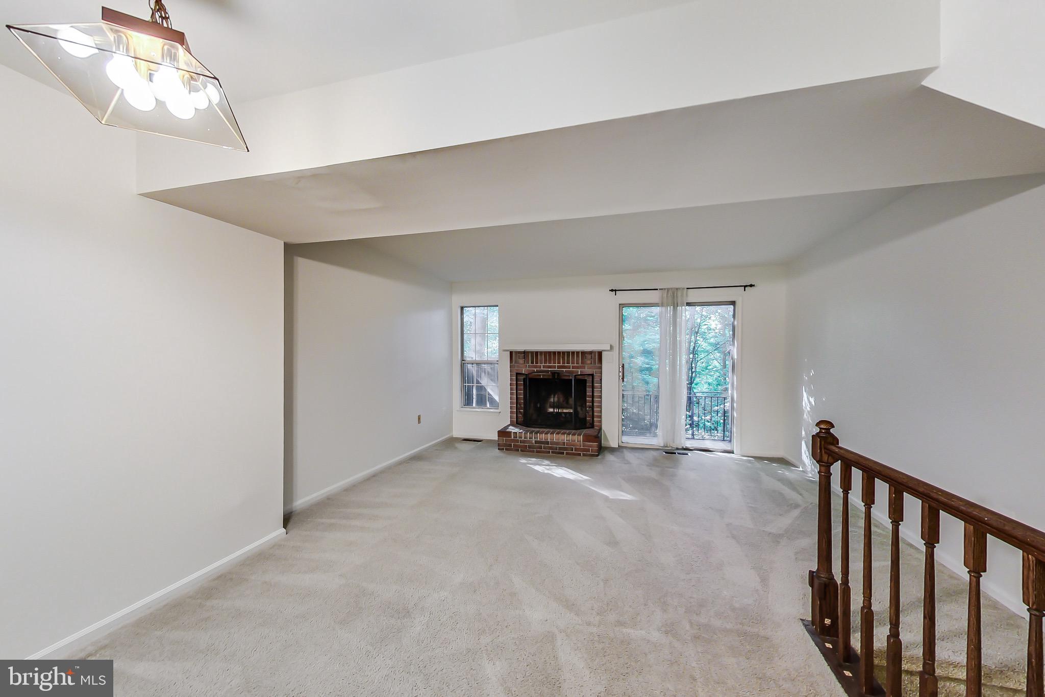 2048 Derby Ridge Lane, Unit 310 Silver Spring, MD 20910 - Photo 4 of 34 Spacious living room, fireplace, & slider to patio