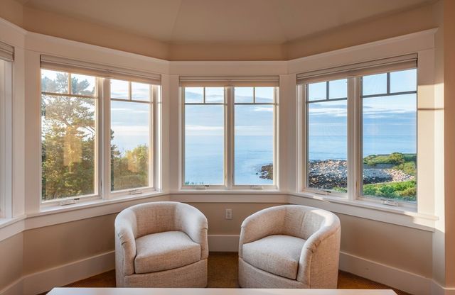 a living room with furniture and windows