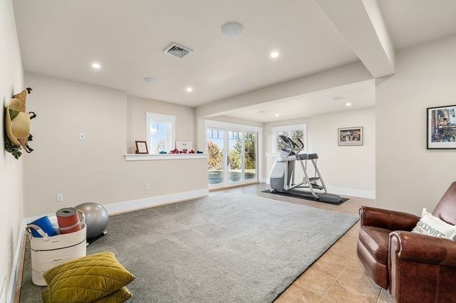 a room with furniture and gym equipment