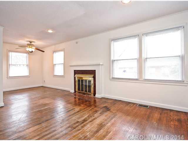 1465 Cortland Road West Charlotte, NC 28209 - Photo 2 of 10 an empty room with wooden floor and windows