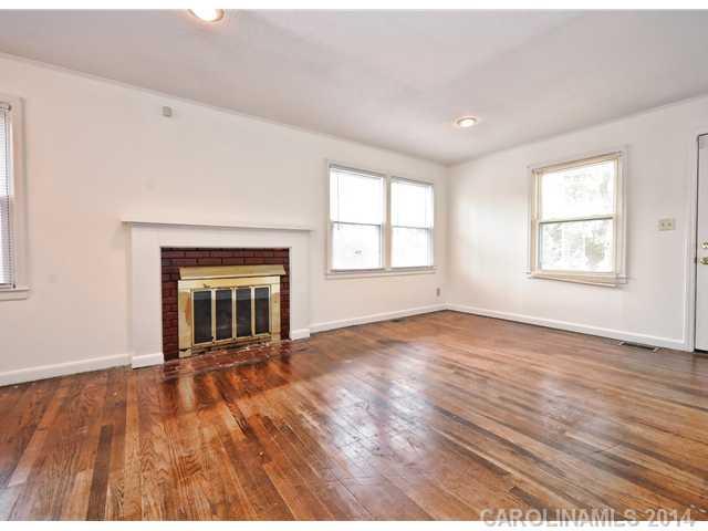 1465 Cortland Road West Charlotte, NC 28209 - Photo 3 of 10 an empty room with wooden floor and windows