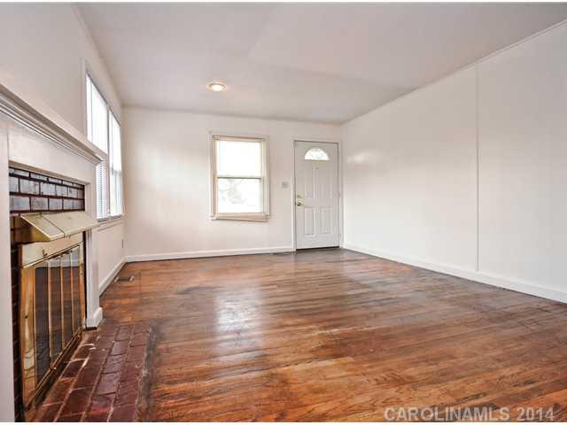 1465 Cortland Road West Charlotte, NC 28209 - Photo 4 of 10 an empty room with wooden floor and windows