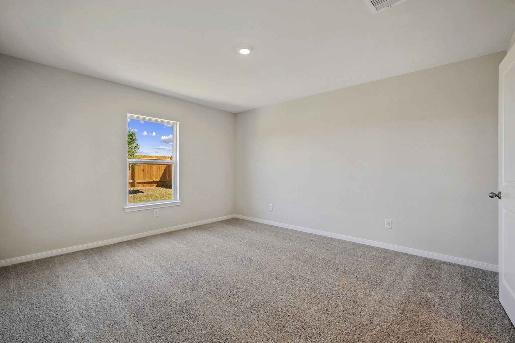 10430 Red Cardinal Drive Cleveland, TX 77328 - Photo 12 of 23 an empty room with window