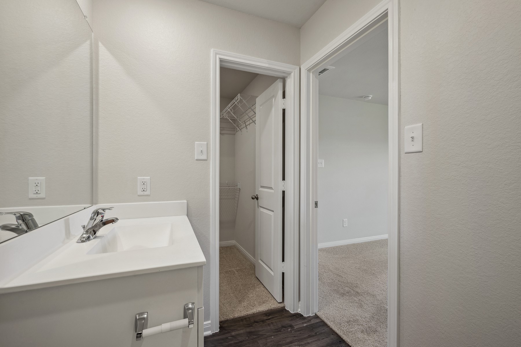 10430 Red Cardinal Drive Cleveland, TX 77328 - Photo 14 of 23 a bathroom with a sink mirror and shower