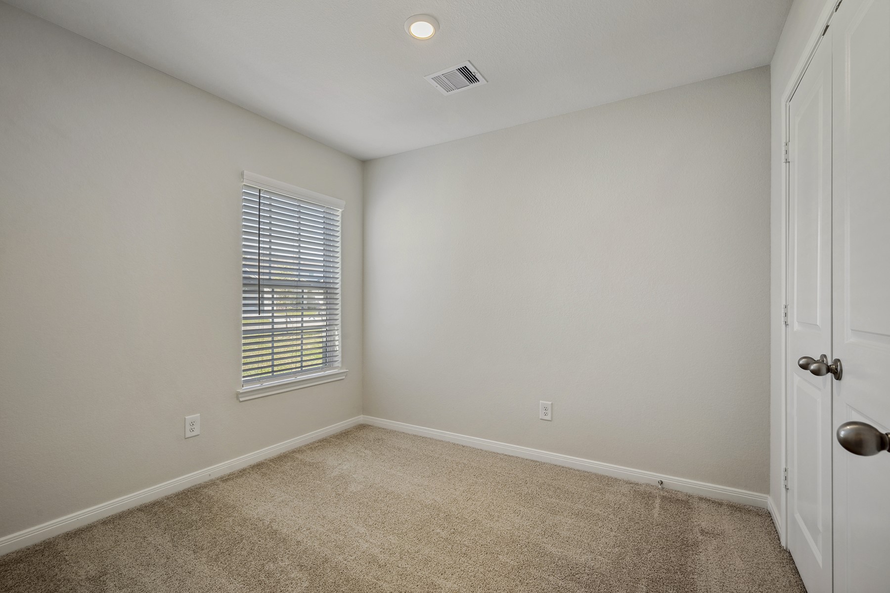 10430 Red Cardinal Drive Cleveland, TX 77328 - Photo 16 of 23 a view of an empty room with a window