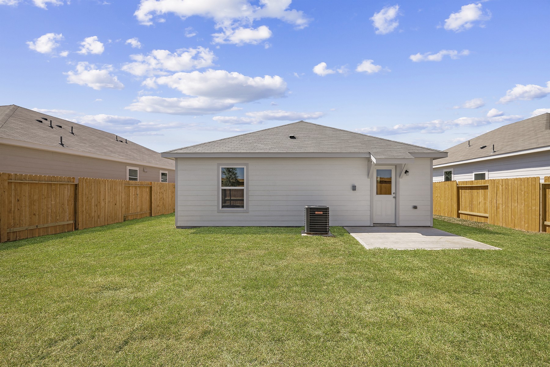 10430 Red Cardinal Drive Cleveland, TX 77328 - Photo 2 of 23 a view of a backyard with a garden and yard