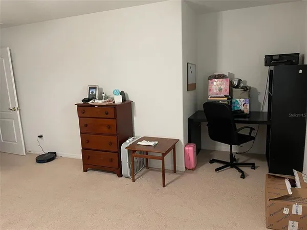 a room with furniture and a piano